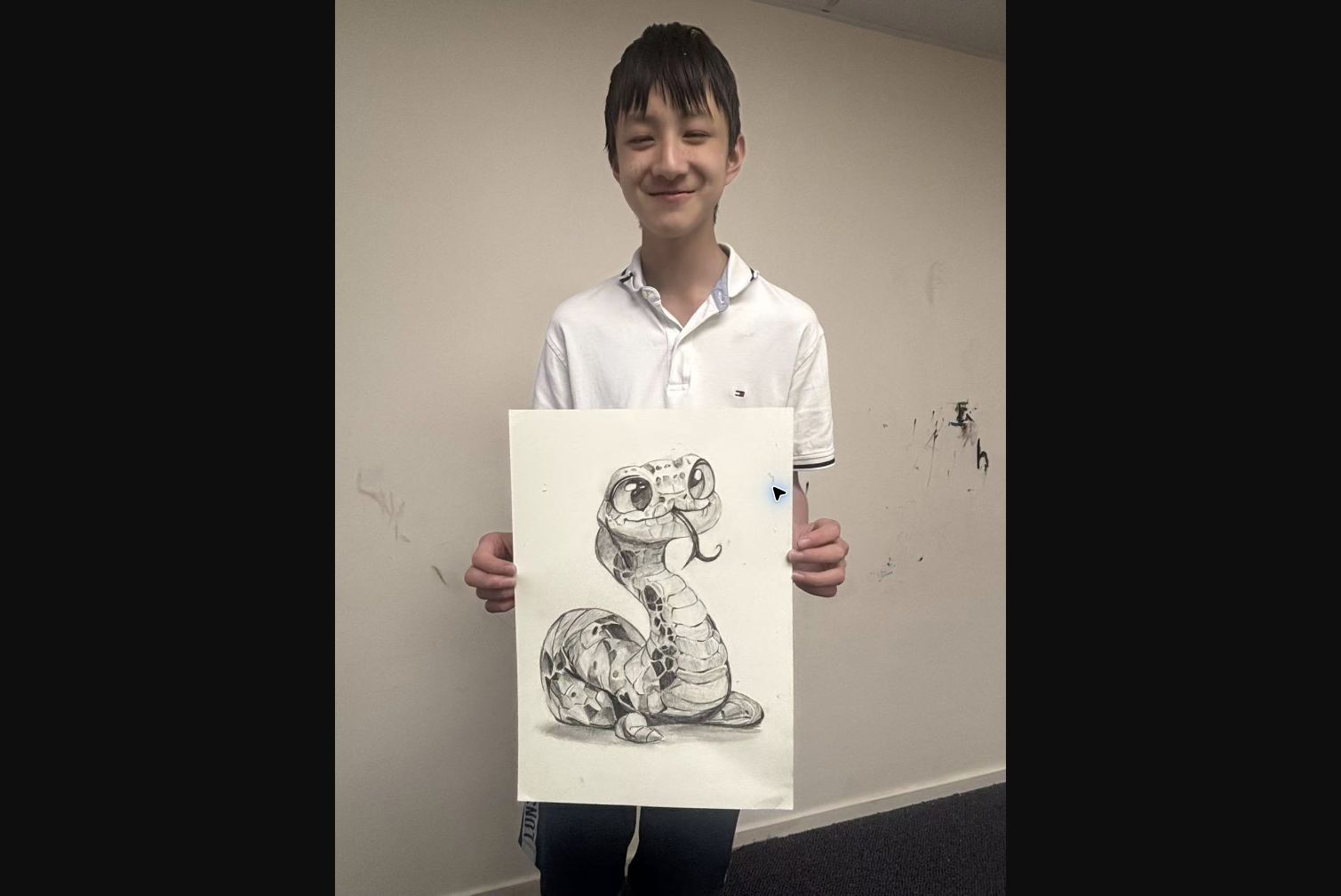 Student showing a detailed snake pencil drawing in an Advanced Class at Art Space Studio Auckland